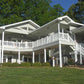 Large white house with multiple porches, Weatherables Berkshire white vinyl deck railing and a well-maintained lawn.