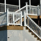 Weatherables Addison white vinyl stair railing and steps on a deck with a dark background