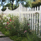 Garden with Weatherables Hampshire white vinyl picket fence and flowers