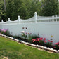 Weatherables Halifax white vinyl scallop-top privacy fence with garden and flowers in a residential setting