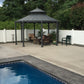 Gazebo with outdoor furniture near a poolside deck with Weatherables Pembroke white vinyl privacy fence