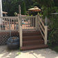 Wooden steps leading to a deck with a garden and Weatherables Berkshire khaki vinyl deck railing in the background