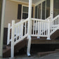Weatherables Greenwich white vinyl stair railing on a set of stairs leading to a house porch.