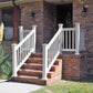 Weatherables Greenwich white vinyl railing on a brick staircase leading to a house entrance