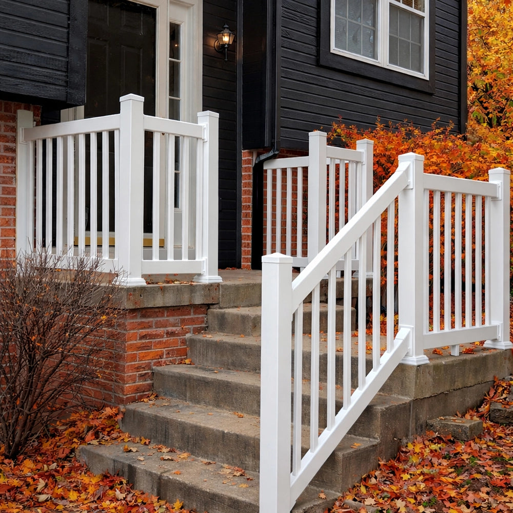 White railing on a set of outdoor steps leading to a house with autumn leaves on the ground, and Weatherables Greenwich white vinyl porch railings.