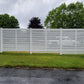 Weatherables Everglade white vinyl semi-privacy horizonal fence in a grassy area with trees in the background
