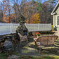 Backyard patio with outdoor furniture, stone fire pit, and Weatherables Provincetown white vinyl picket fence.