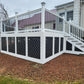 Weathrables Bolton white vinyl deck railing with black aluminum balusters in front of a house