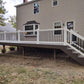 House with a newly constructed deck, Weatherables Bolton white vinyl deck railing and staircase