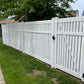 Weatherables Huntington white vinyl  semi-privacy fence with a gate in a residential area