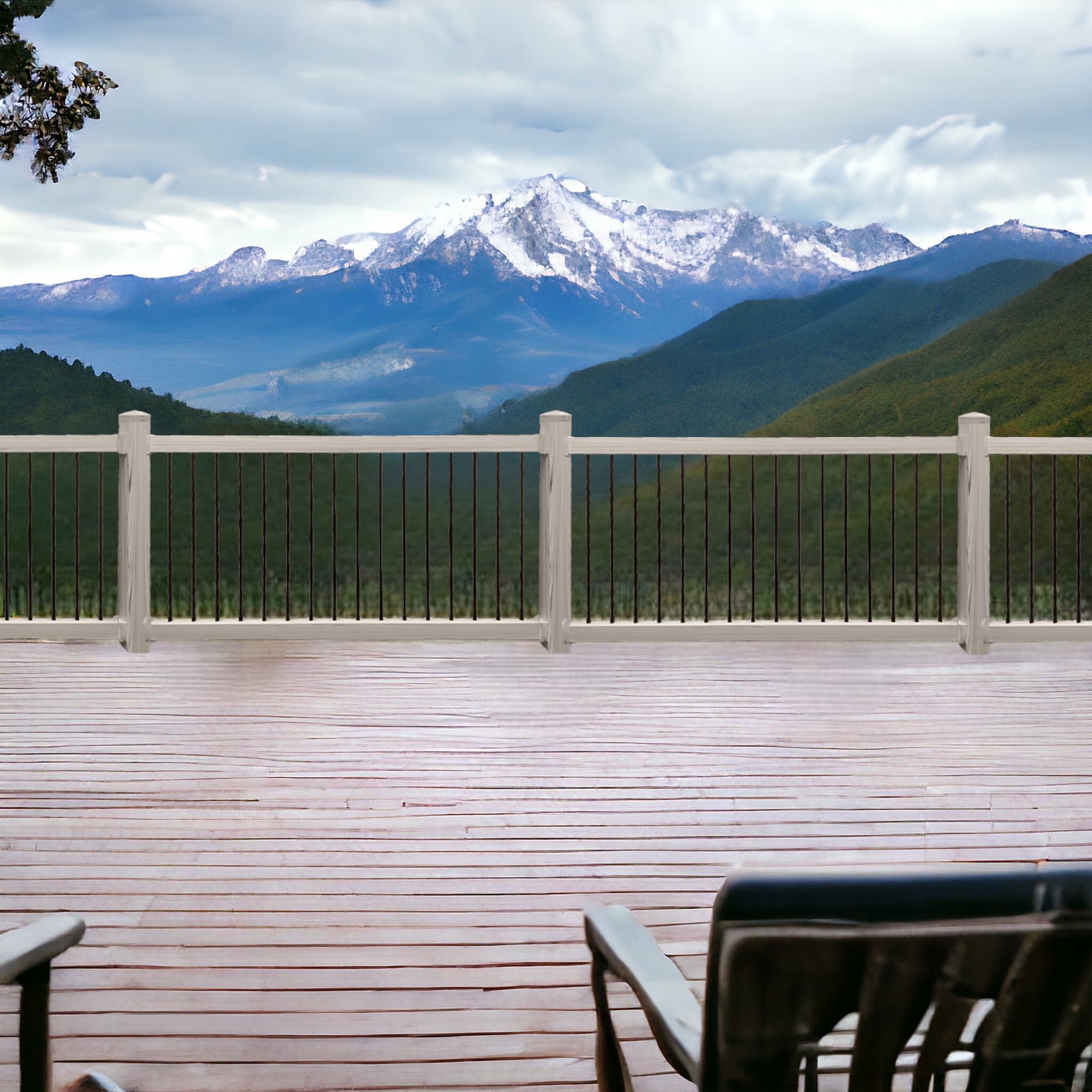 Wooden deck with a Weatherables Bedford coastal grey vinyl deck railing overlooking snow-capped mountains and green valleys.