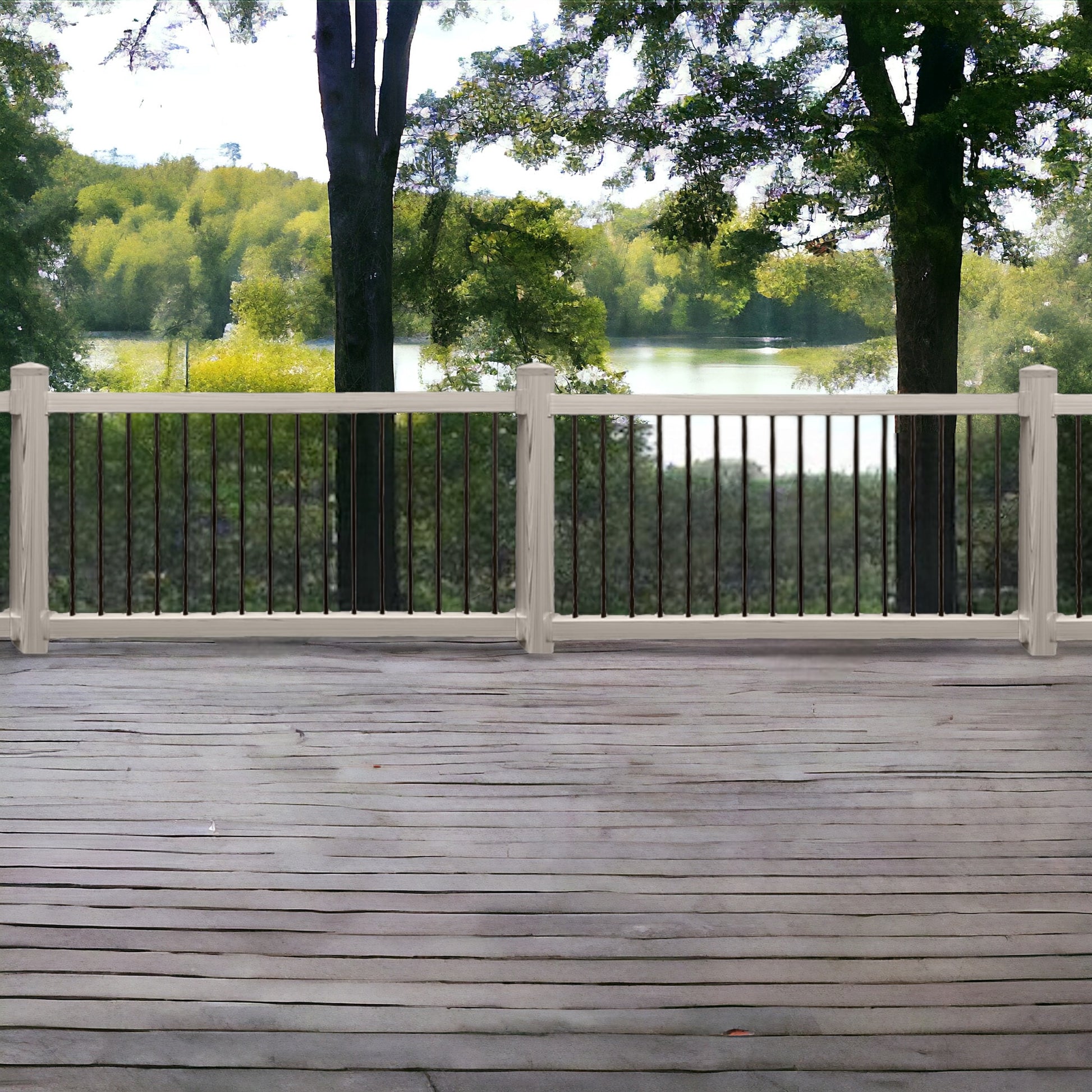 Wooden deck with coastal grey Bedford vinyl deck railing overlooking a lake and trees